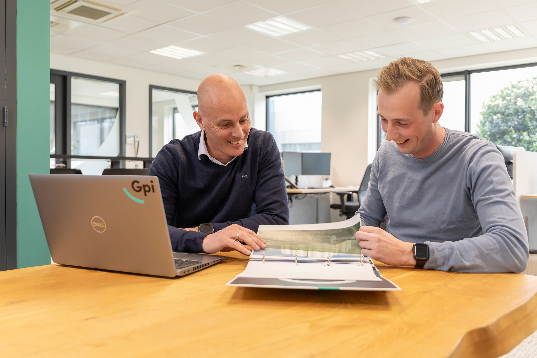 Senior Sales Engineer Eric Dekkers consulting with a colleague at Gpi Tanks XL